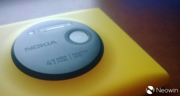 Nokia Lumia turned upside down on a table with the 41MP camera in focus