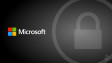 Microsoft logo on a gray background with a lock icon in a circle on the right side