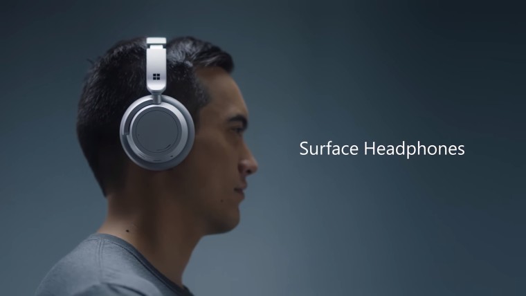 Man wearing headphones with Surface Headphones text