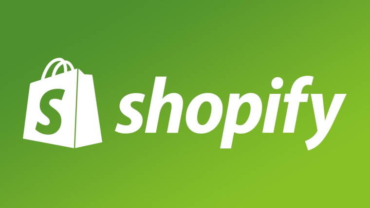 groceries bag labeled with a large S and the word Shopify next to it