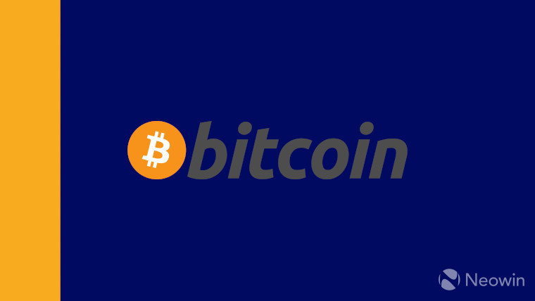 The bitcoin logo on a blue and gold background