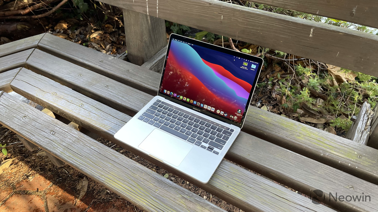 Angled shot of MacBook Pro on wooden bench