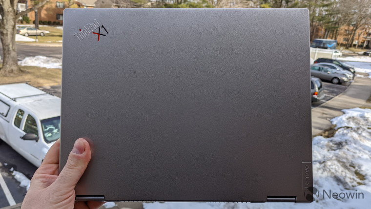 ThinkPad X1 Titanium Yoga being held with one hand