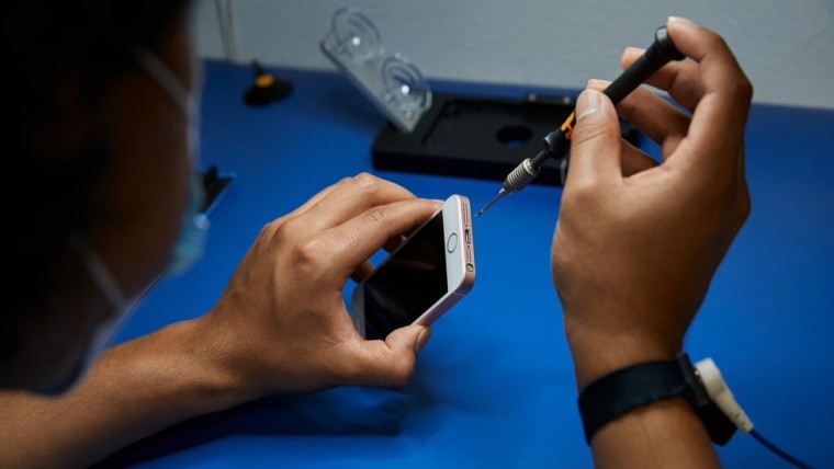 An iPhone being repaired by an independent repair provider