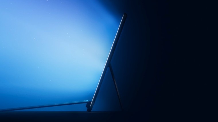 A Surface Pro like device placed sideways emitting blue light from its dispaly