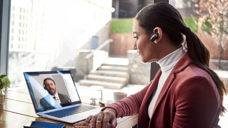 A woman on a call to a colleague