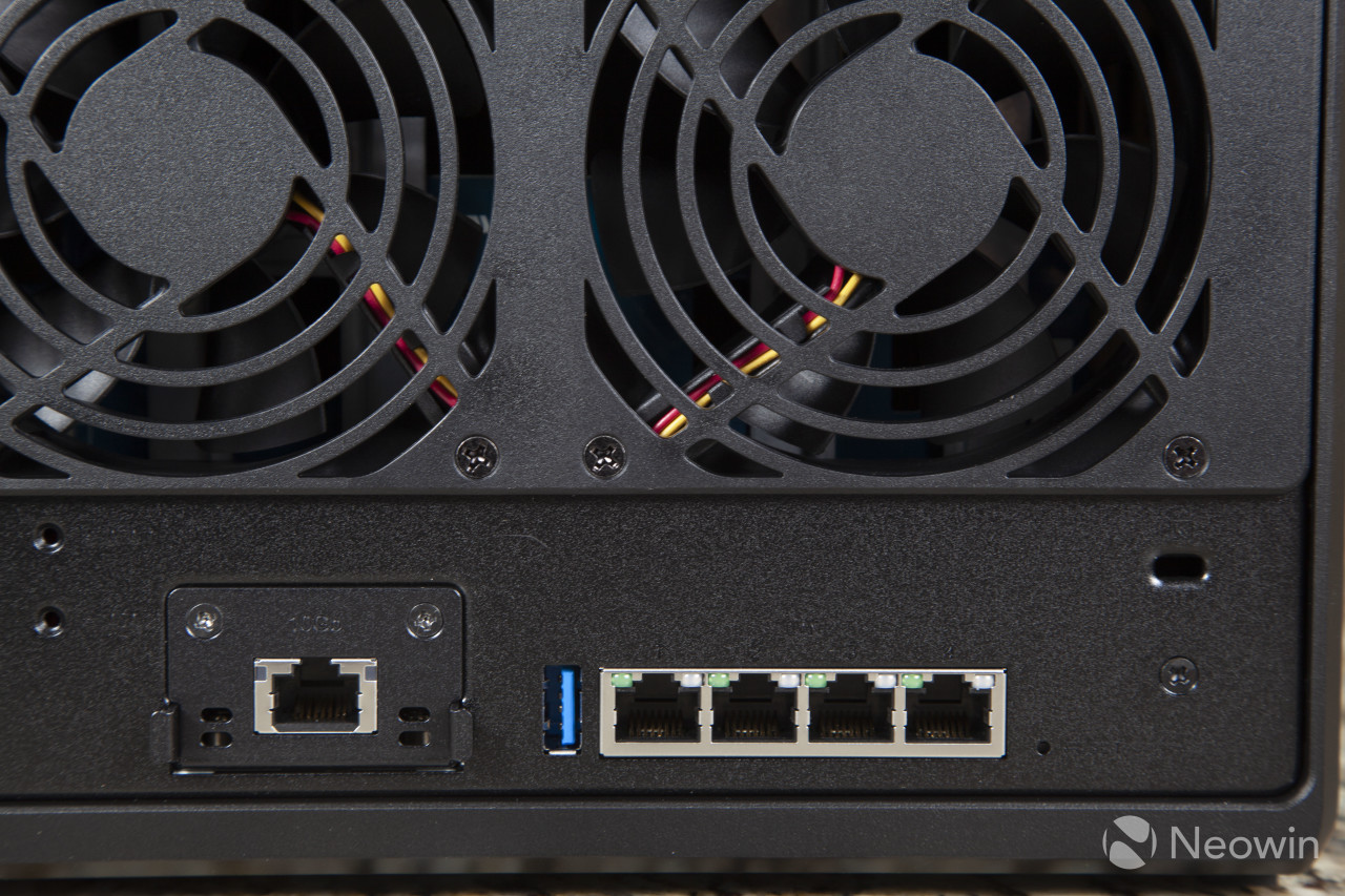 Picture of the back of the Synology DS1522 showing four Ethernet ports and the PCIe card installed