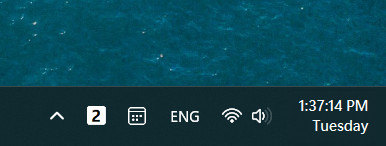 A screenshot of Windows 11s taskbar clock modified by ElevenClock app