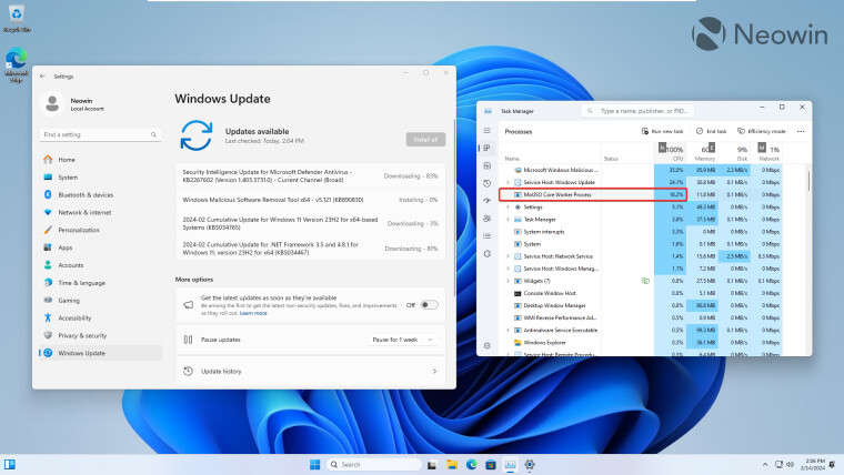 Windows 11 Settings app installing updates next to Task Manager