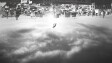 black and white image of man falling upside down