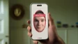 A hand holding a phone for a selfie where the screen says Tinder and is a photo of his face and says