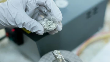 a scientist working with some chemical compound in a lab