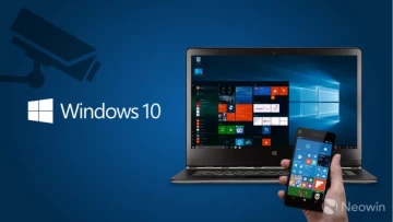 Windows 10 laptop and Windows Phone with a camera spying on the left