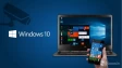 Windows 10 laptop and Windows Phone with a camera spying on the left