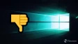 Windows 10 wallpaper with a thumbs down emoji next to it
