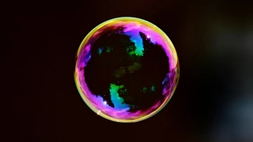 a bubble reflecting the photons and various colors of light