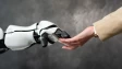 A robot hand holding a human hand
