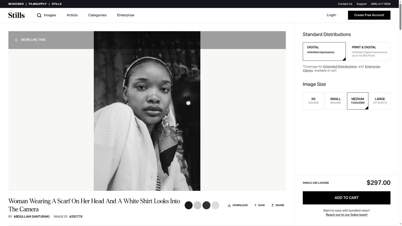 Woman Wearing A Scarf On Her Head And A White Shirt Looks Into The Camera