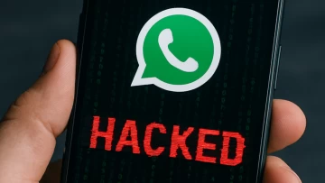 WhatsApp icon on a phone screen with hacked written below it