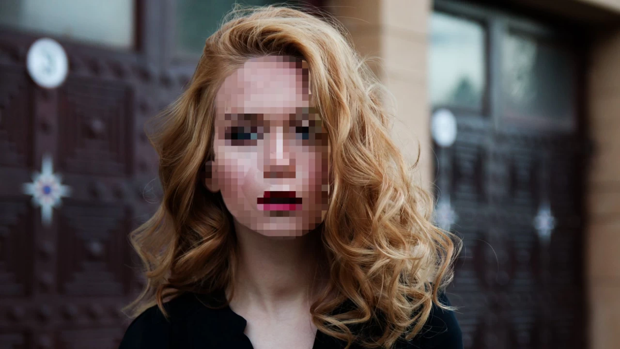 Woman with pixelated face
