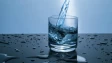 a glass with a liquid being poured into it