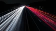 time lapse snap of a highway at night with several vehicles