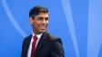 Rishi Sunak in front of a blue background