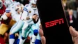 The ESPN logo in front of an American football game