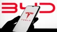 The Tesla and BYD logos