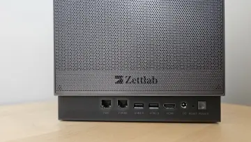 Photograph of the Zettlab D4 with dust shield on the back