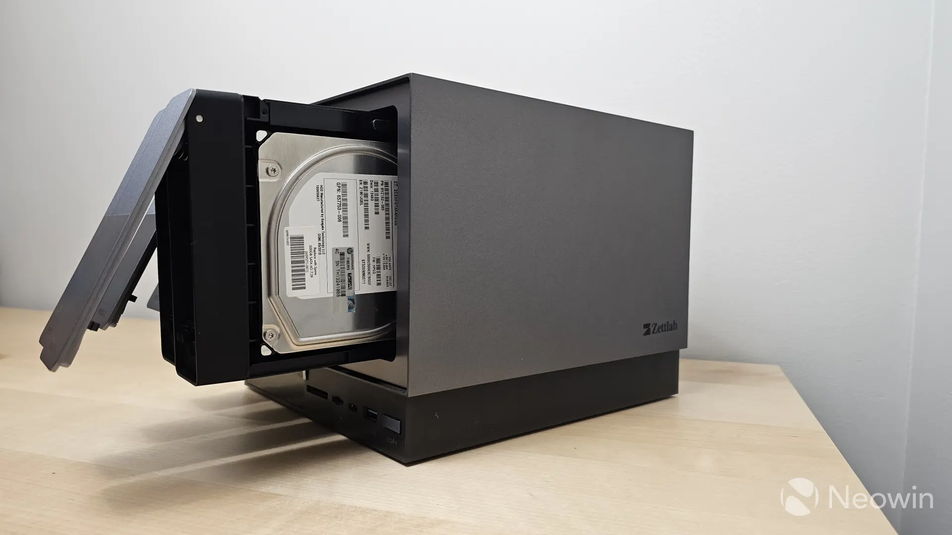Photo of the side of the Zettlab D4 with drives not fully inserted