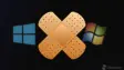 Windows logos blurred in the background with a band-aid superimposed on top