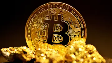 Bitcoin behind gold nuggets