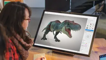 A woman working with a Windows PC and the 3D Viewer app