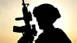 A shadow of a solider with a gun