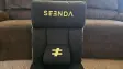 Photo of the Seenda GCP-10A floor gaming chair on the ground in front of a brown couch