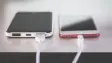 two phones charging side by side
