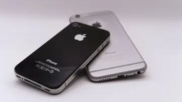apple iphone laying on top of another