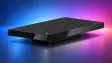 Microsoft Surface RTX Spark Dev Box a compact black desktop PC with a vented top shown against a vib